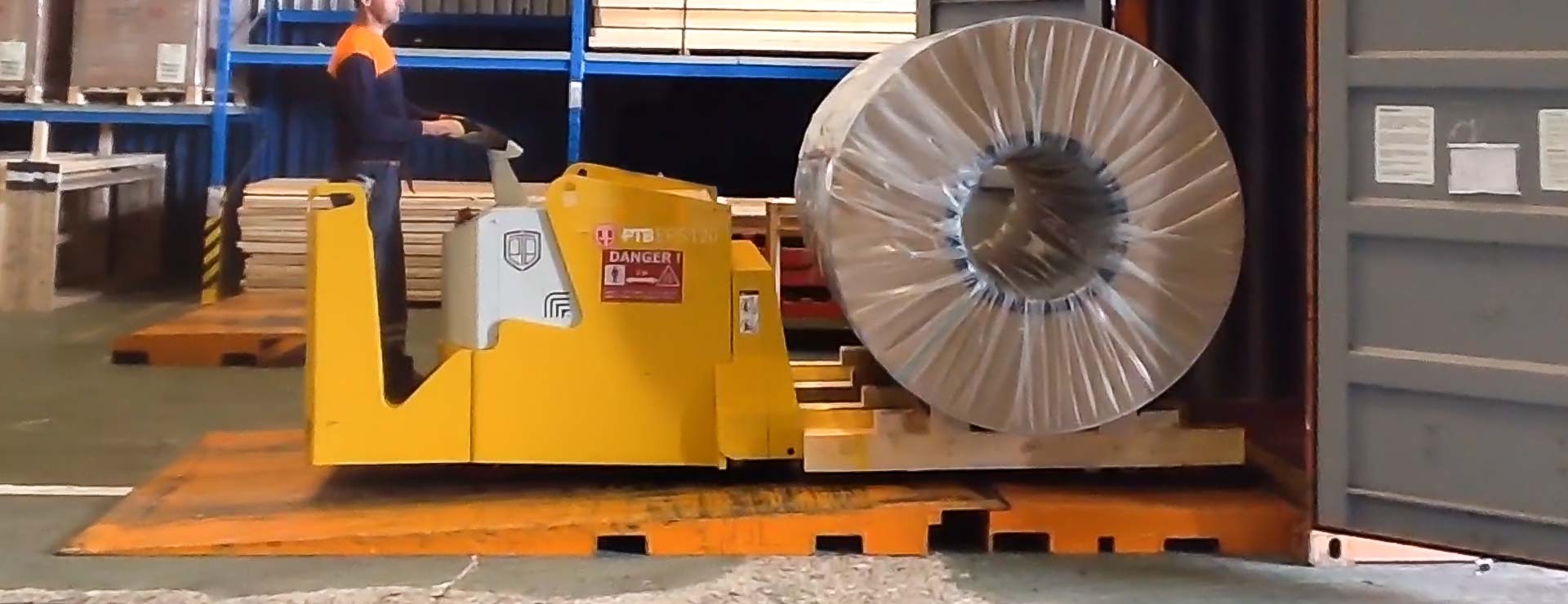 12 ton coils over a 10% slope into a shipping container